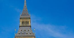 Big Ben tower against a clear blue sky, showcasing its iconic clock face, Gothic architecture, and beautiful details.