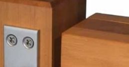 Close-up of a heavy-duty door hinge showcasing robust design for large wooden doors, ensuring durability and stability.