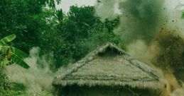 Vietnam War scene depicting explosive action near a thatched hut surrounded by dense greenery and foliage.