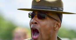 U.S. Army drill sergeant shouting orders during training, demonstrating leadership and discipline in military exercises.