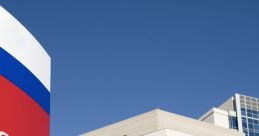 Emergency entrance of a modern hospital with clear signage and a blue sky backdrop for effective wayfinding and accessibility.