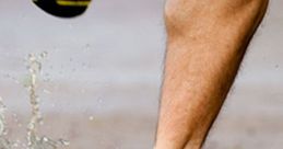 Close-up of a runner's shoe splashing through puddles on a country road, capturing the joy of outdoor exercise.