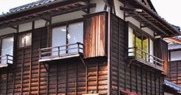 Traditional wooden building with a sign, surrounded by stone pathways, evoking a serene atmosphere for peaceful walking.