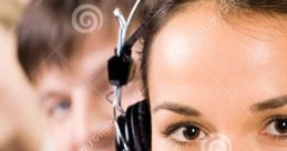 Smiling phone operator in headset, providing customer support with team members in the background, showcasing effective communication.