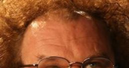 Steve Brule with curly hair and glasses, showcasing his iconic quirky expression and distinctive style.