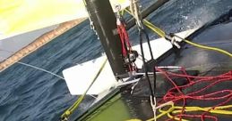 Close-up of sailing equipment with ropes and rigging on a boat; showcasing dynamic sailing conditions and performance.