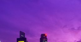 Stunning city skyline at dusk, with illuminated skyscrapers against a vibrant purple sky reflecting on the water.