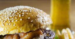 Juicy hamburger with sesame seed bun, fresh lettuce, tomatoes, crispy bacon, served with fries and a cold beer.