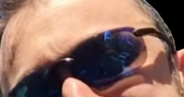 Close-up of a smiling man wearing sunglasses, epitomizing enthusiasm and engagement in a gaming context, ideal for MTG fans.