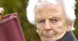 Elderly Scottish lady in a dark coat, confidently holding a bag with a serious expression, showcasing traditional culture.