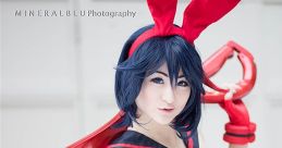 Cosplayer in a playful bunny outfit with red accents, embodying a character from popular anime culture.