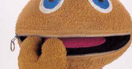 Zippy from Rainbow smiles playfully, showcasing his signature blue eyes and zippered mouth in a vibrant display of fun.