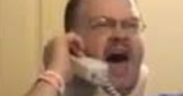 Tourettes Guy Mega passionately yells into a phone while wearing a neck brace, showcasing his unique humor and expression.