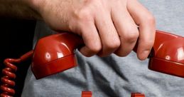 Hand holding a red retro phone, ready to hang up the phone after a conversation, showcasing nostalgic communication.