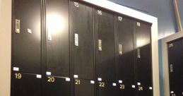 Lockers in a modern facility with a logo, highlighting the organized space at PressBox for secure storage.