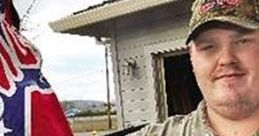 Man with Confederate flag tattoo on arm poses outdoors, showcasing a typical illustration of Southern pride.