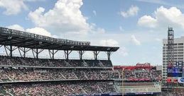 Busy ballpark scene during a 2021 baseball game, showcasing fans, players, and vibrant field under a blue sky.