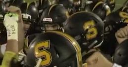 Team huddles for FNF game, showcasing determination and unity in football uniforms with prominent yellow and black helmets.