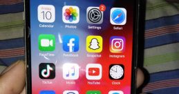 Close-up of an iPhone screen displaying popular apps like Instagram, TikTok, and Netflix against a colorful background.