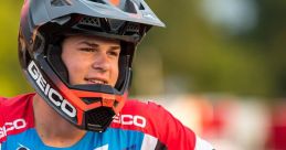 Jett speaks with confidence while preparing for motocross, showcasing his Geico gear and vibrant racing spirit.