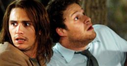 Seth Rogen and James Franco in a suspenseful moment from Pineapple Express, showcasing their comedic chemistry and tension.