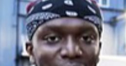 KSI laughing enthusiastically, wearing a bandana and casual clothing, showcasing his vibrant personality.