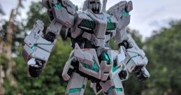 Gundam model standing confidently outdoors, showcasing intricate details and vibrant colors against a natural backdrop.