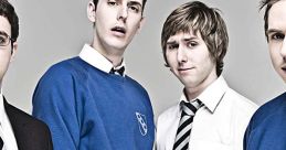 Four teenage boys in school attire from "The Inbetweeners," showcasing their unique styles and expressions.