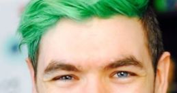 Jacksepticeye smiling with vibrant green hair, showcasing his energetic personality and engaging content style.