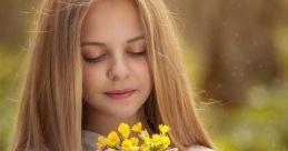 Girl gently holding a bouquet of vibrant wildflowers, radiating tranquility and connection to nature in a serene outdoor setting.