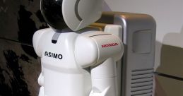 Honda ASIMO robot model with a futuristic design, showcasing advanced robotics and mobility technology in a modern display.