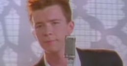 Rick Astley performing his hit song, iconic for the Rick Roll meme, wearing a striped shirt and suit, singing passionately.