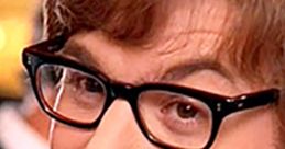 Austin Powers character in glasses, showcasing his iconic mischievous smile and 1960s retro style. Fun and groovy vibe.