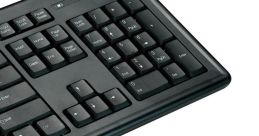 Black computer keyboard and mouse, featuring a sleek design and essential keys for efficient productivity and comfort.