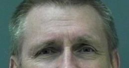 Mugshot of Kent Hovind, controversial figure in creationism debates, known for his unconventional views on evolution.