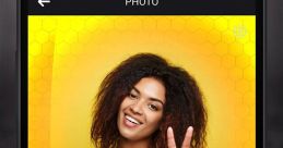 Smiling woman showing peace sign on an Android app screen with colorful effects like Hypno and Honey Comb.