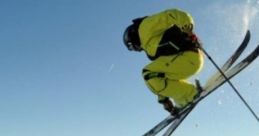 A skier in a bright yellow outfit performs a jump against a stunning mountainous backdrop, perfect for winter sports enthusiasts.