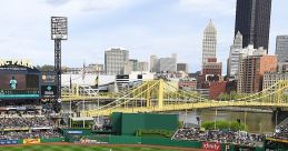 Vibrant scene at PNC Park during a baseball game, showcasing players, fans, and the iconic Pittsburgh skyline.