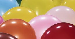 Colorful balloons in various shades, including green, pink, and blue, creating a festive and cheerful atmosphere.