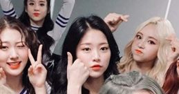 Loona group photo showcasing members posing playfully, displaying charming expressions and unique hairstyles.