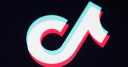 Close-up of the TikTok logo with vibrant colors on a dark background, showcasing the platform's branding and design.