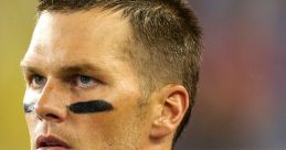 Tom Brady focused during a game, wearing a Patriots jersey with the Super Bowl champions logo prominently displayed.