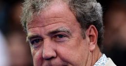 Jeremy Clarkson at a public event, showcasing his distinctive style and personality, known for automotive commentary.