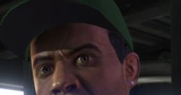 Lamar Davis from GTA V with an intense expression, wearing a green cap and black shirt. Intrigued character moment.