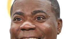 Tracy Morgan shares a joyful moment at an awards ceremony, showcasing his signature smile in a classic tuxedo.