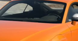 Stylish orange sports car showcasing sleek design and performance features, perfect for TTS dźwięki enthusiasts.