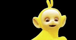 Laa-Laa from Teletubbies, the playful yellow character, running joyfully from the PlayStation game "Play with the Teletubbies.