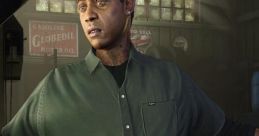 Character from GTA 5 wearing a green shirt, gesturing in a garage with classic cars in the background.