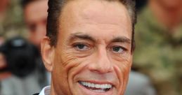 Jean-Claude Van Damme smiling at a red carpet event, showcasing his charismatic presence and iconic style.