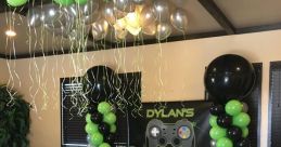 Festive game zone setup for Dylan's birthday party, featuring Lunatic Festa 4 theme, vibrant green and black decor, and snacks.